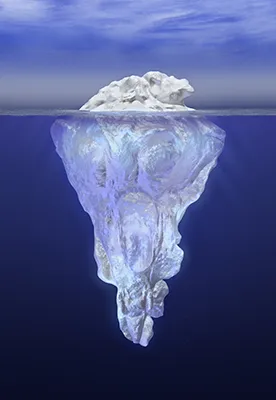 Iceberg in water extending above and below the surface